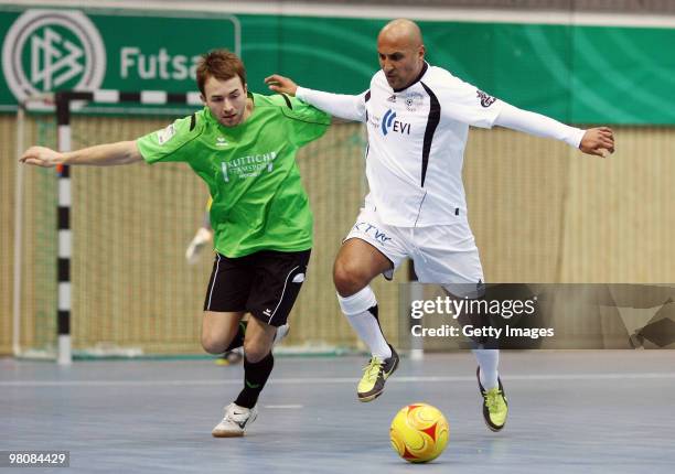 Players of VfV 06 Borussia Hildesheim and Futsal Club Portus Pforzheim battle for the ball during the DFB futsal cup at the Lausitz-Arena on March...