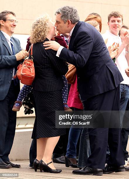 Prime Minister Gordon Brown greets delegates as he arrives at the Glasgow Science Centre to address the Scottish Labour Party Conference on March 27,...