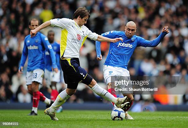 Niko Kranjcar of Tottenham Hotspur is challenged by Anthony Vanden Borre of Portsmouth during the Barclays Premier League match between Tottenham...