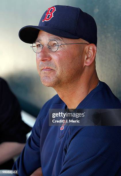 Manager Terry Francona of the Boston Red Sox talks with reporters in the dugout just prior to the start of the Grapefruit League Spring Training Game...