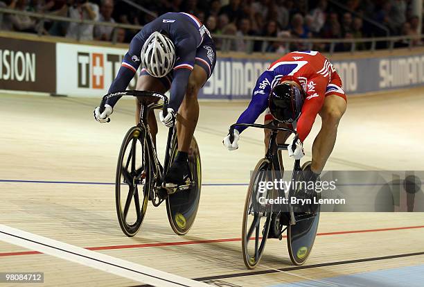 Sir Chris Hoy of Great Britain rides against Gregory Bauge of France in the Quarterfinals of the Men's Sprint on day four of the UCI Track Cycling...