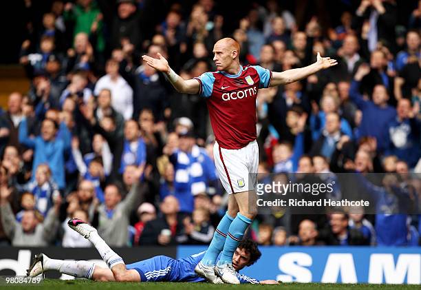 Yury Zhirkov of Chelsea goes to ground after a challenge by James Collins of Aston Villa leading to a penalty during the Barclays Premier League...