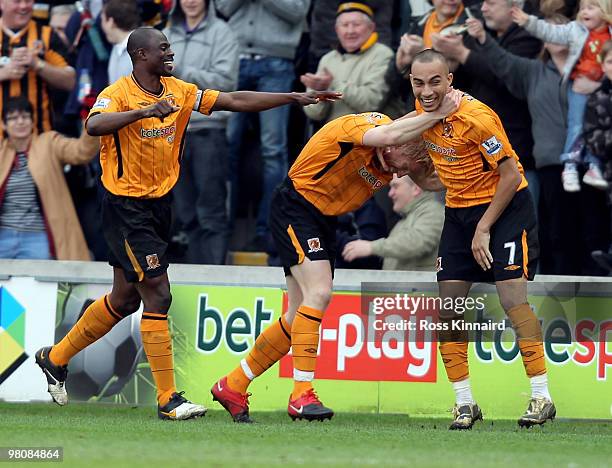 Craig Fagan of Hull is congratulatd after scoring the second goal during the Barclays Premier League match between Hull City and Fulham at the KC...