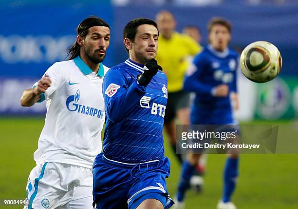 Leandro Fernandez of FC Dinamo Moscow battles for the ball with Danny of FC Zenit St. Petersburg during the Russian Football League Championship...