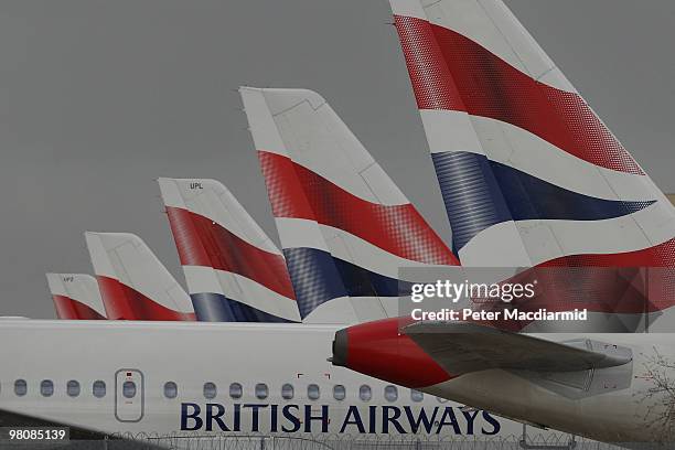 British Airways aircraft are parked on an apron at Heathrow airport during the first day of a strike by cabin crew on March 27, 2010 in London,...