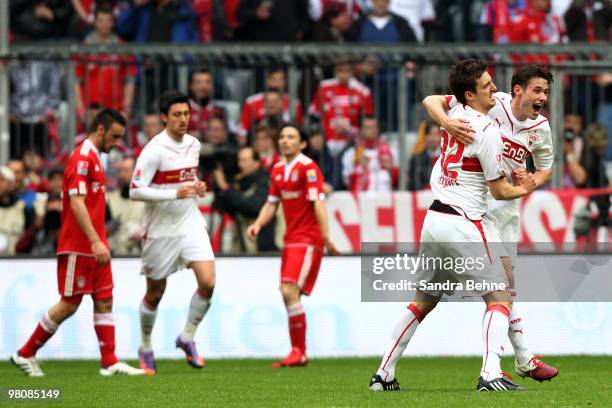 Christian Traesch of Stuttgart celebrates with his team mate after scoring his team's first goal during the Bundesliga match between FC Bayern...
