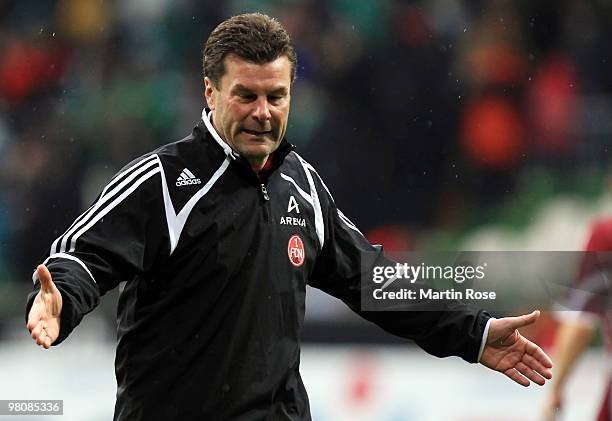 Dieter Hecking, head coach of Nuernberg looks dejected after the Bundesliga match between Werder Bremen and 1. FC Nuernberg at the Weser Stadium on...