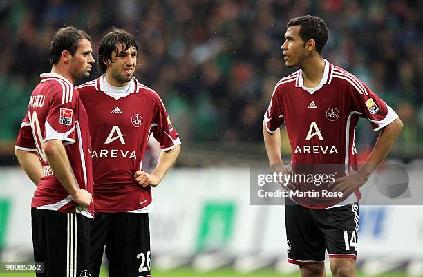 Albert Bunjaku, Thomas Broich and Eric Maxim Choupo Moting of Nuernberg look dejected after the Bundesliga match between Werder Bremen and 1. FC...