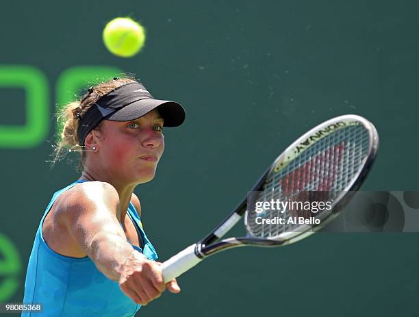 Yanina Wickmayer of Belgium returns a shot against Petra Martic of Croatia during day five of the 2010 Sony Ericsson Open at Crandon Park Tennis...