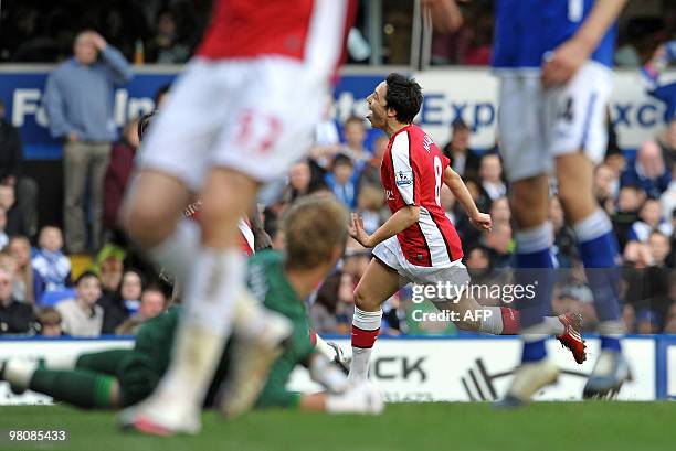 Arsenal's French midfielder Samir Nasri celebrates scoring the opening goal past English goalkeeper Joe hart during the English Premier League...