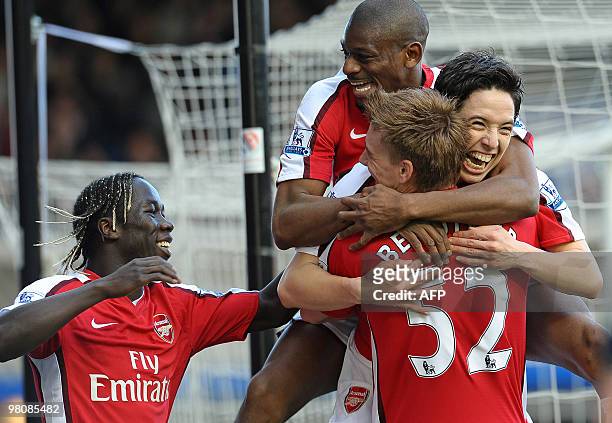 Arsenal's French midfielder Samir Nasri celebrates scoring the opening goal with team-mates during the English Premier League football match between...