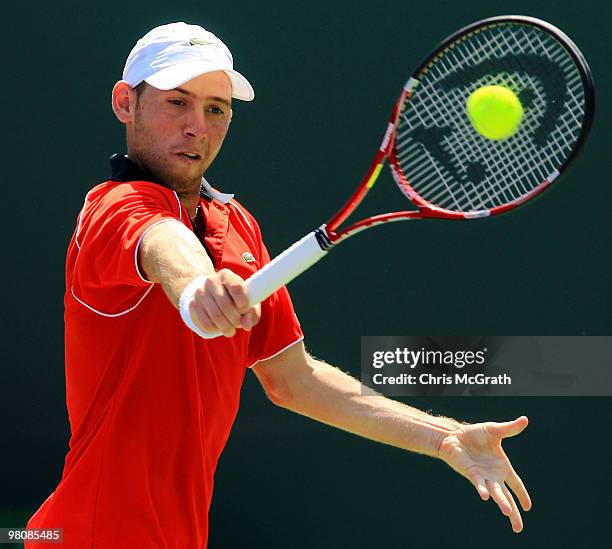 Dudi Sela of Israel returns a shot against Fernando Verdasco of Spain during day five of the 2010 Sony Ericsson Open at Crandon Park Tennis Center on...