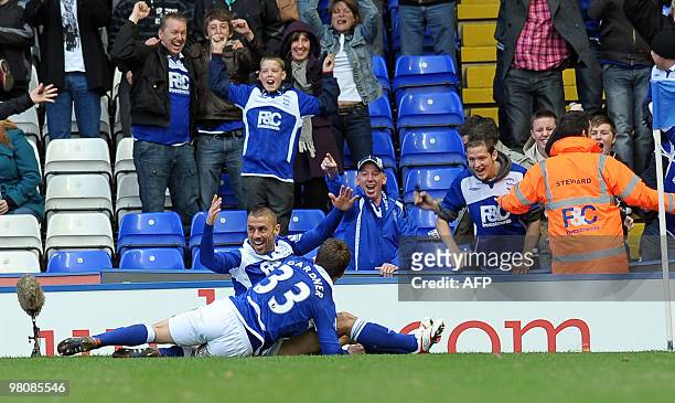 Birmingham City's English forward Kevin Phillips celebrates scoring a late equalizing goal in the English Premier League football match between...