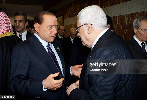 In this handout image supplied by the Palestinian Press Office , Palestinian President Mahmoud Abbas talking to Italian Prime Minister Silvio...