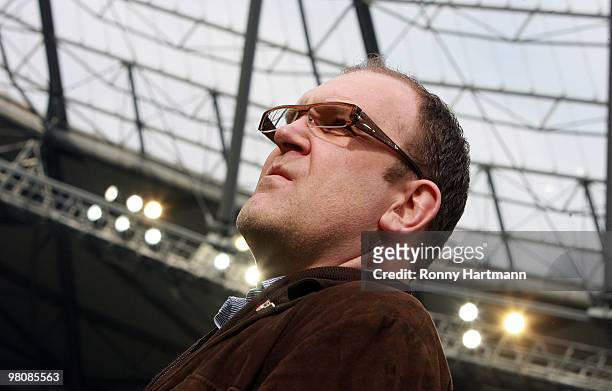 Manager Joerg Schmadtke of Hannover looks on prior to the Bundesliga match between Hannover 96 and 1. FC Koeln at AWD Arena on March 27, 2010 in...