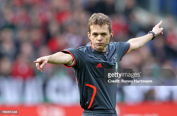 Referee Jochen Drees gestures during the Bundesliga match between Hannover 96 and 1. FC Koeln at AWD Arena on March 27, 2010 in Hanover, Germany.
