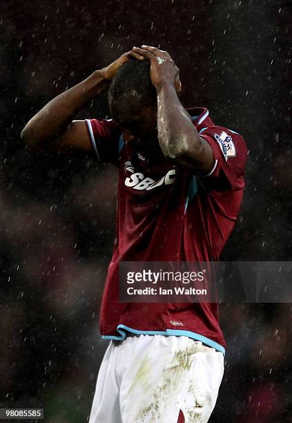 Dejected Carlton Cole of West Ham reacts after his team lose 1-0 during the Barclays Premier League match between West Ham United and Stoke City at...