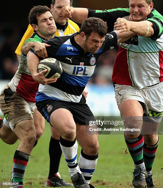 Lee Mears of Bath hands off Danny Care and John Andress of Harlequins during the Guinness Premiership match between Bath and Harlequins at the...