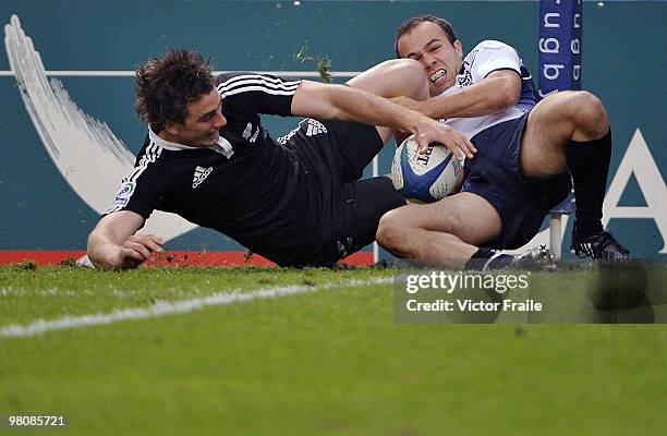 Kurt Baker of New Zealand reaches over the line to score a try against Scotland on day two of the IRB Hong Kong Sevens on March 27, 2010 in Hong Kong.