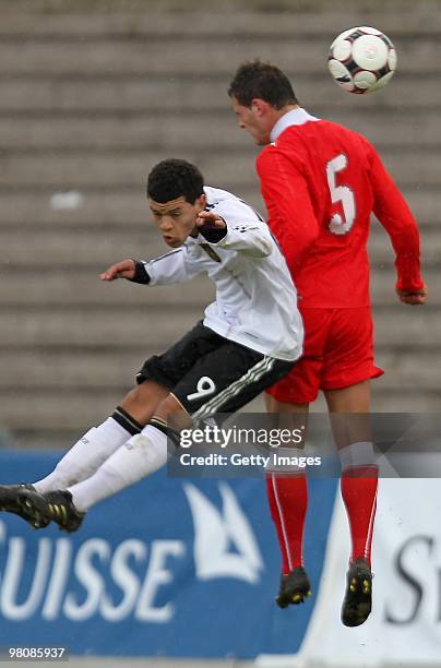 Shawn Parker of Germany jumps for a header with Arlind Ajeti of Switzerland during the U17 Euro Qualifier match between Switzerland and Germany at...