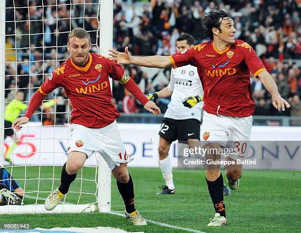 Daniele De Rossi and Luca Toni of Roma celebrate the opening goal during the Serie A match between AS Roma and FC Internazionale Milano at Stadio...