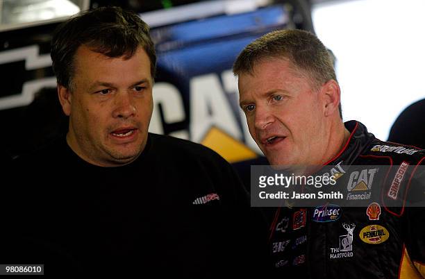 Jeff Burton , driver of the Caterpillar Chevrolet speaks with crew chief Todd Berrier , during practice for the NASCAR Sprint Cup Series Goody's Fast...