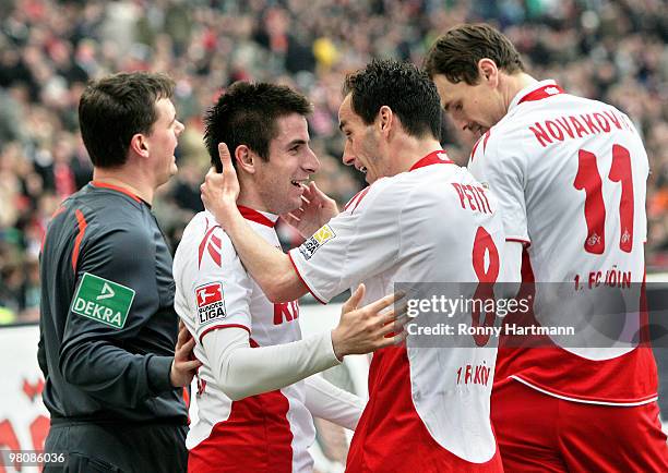 Zoran Tosic of Koeln celebrate after scoring with Petit and Milivoje Novakovic during the Bundesliga match between Hannover 96 and 1. FC Koeln at AWD...