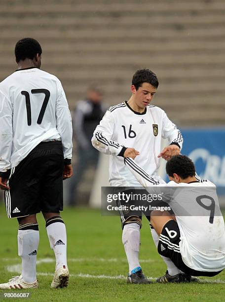 Roussel Ngankam , Amin Younes and Shawn Parker of Germany are dejected after Germany lost the game 1:0 against Switzerland afther the U17 Euro...