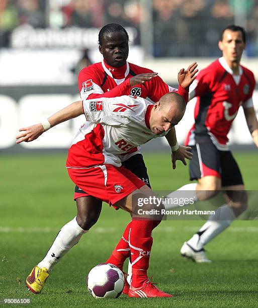 Miso Brecko of Koeln battles for the ball with Didier Ya Konan of Hannover during the Bundesliga match between Hannover 96 and 1. FC Koeln at AWD...