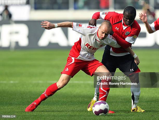 Miso Brecko of Koeln battle for the ball with Didier Ya Konan of Hannover during the Bundesliga match between Hannover 96 and 1. FC Koeln at AWD...