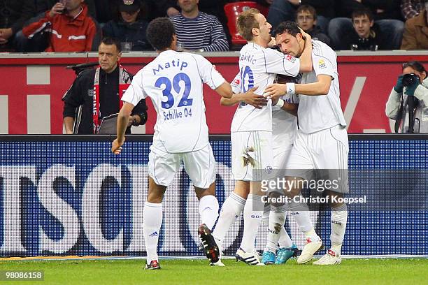 Kevin Kuranyi of Schalke celebrates after scoring his second goal with team mates Ivan Rakitic and Joel Matip of Schalke during the Bundesliga match...
