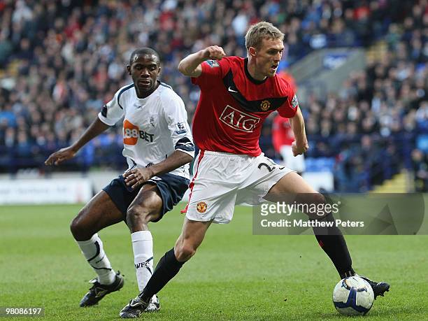 Darren Fletcher of Manchester United clashes with Fabrice Muamba of Bolton Wanderers during the FA Barclays Premier League match between Bolton...