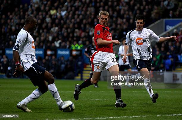 Jlloyd Samuel of Bolton Wanderers scores an own goal during the Barclays Premier League match between Bolton Wanderers and Manchester United at the...