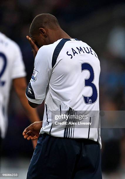 Jlloyd Samuel of Bolton Wanderers reacts after scoring an own goal during the Barclays Premier League match between Bolton Wanderers and Manchester...