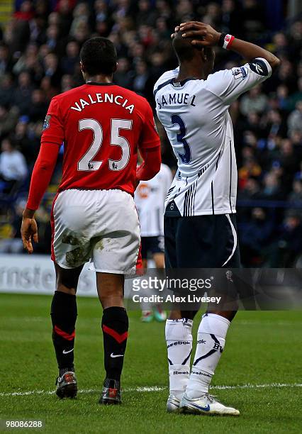Jlloyd Samuel of Bolton Wanderers reacts after scoring an own goal during the Barclays Premier League match between Bolton Wanderers and Manchester...
