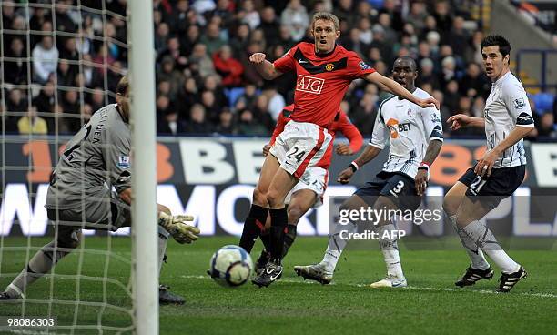 Bolton Wanderers' Trinidad and Tobago defender Jlloyd Samuel scores an own goal during the English Premier League football match between Bolton...