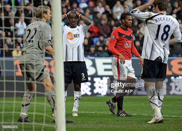 Bolton Wanderers' Trinidad and Tobago defender Jlloyd Samuel reacts after scoring an own goal during the English Premier League football match...