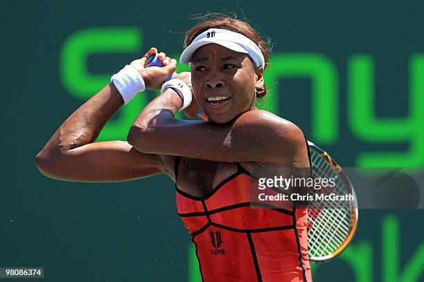 Venus Williams of the United States returns a shot against Roberta Vinci of Italy during day five of the 2010 Sony Ericsson Open at Crandon Park...