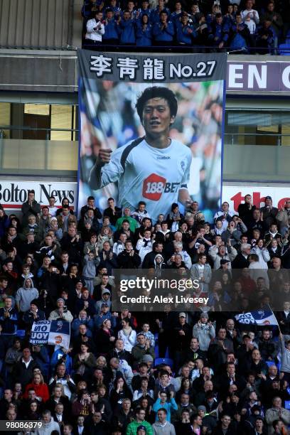 Bolton fans show off a banner of Chung Yong Lee of Bolton Wanderers during the Barclays Premier League match between Bolton Wanderers and Manchester...