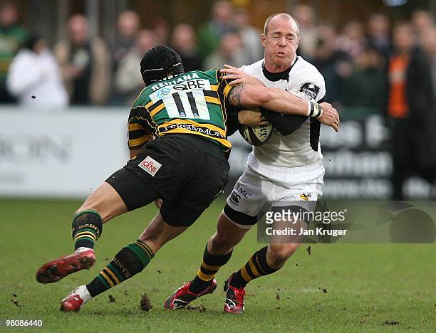 Mark Van Gisbergen of Wasps is tackled by Bruce Reihana of Northampton during the Guinness Premiership match between Northampton Saints and London...