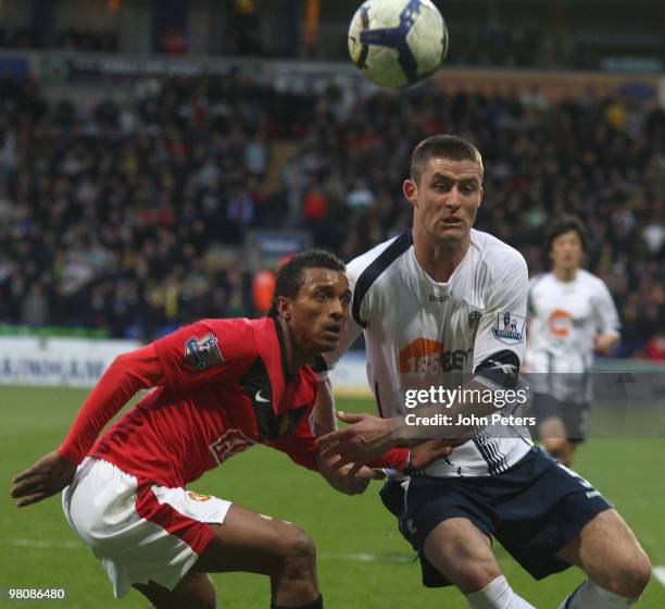 Nani of Manchester United clashes with Gary Cahill of Bolton Wanderers during the FA Barclays Premier League match between Bolton Wanderers and...