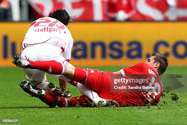 Miroslav Klose of Bayern Muenchen tackles Sami Khedira of Stuttgart during the Bundesliga match between FC Bayern Muenchen and VfB Stuttgart at...
