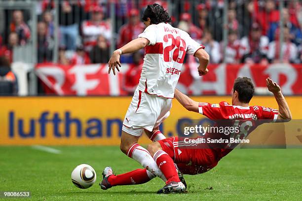 Miroslav Klose of Bayern Muenchen tackles Sami Khedira of Stuttgart during the Bundesliga match between FC Bayern Muenchen and VfB Stuttgart at...