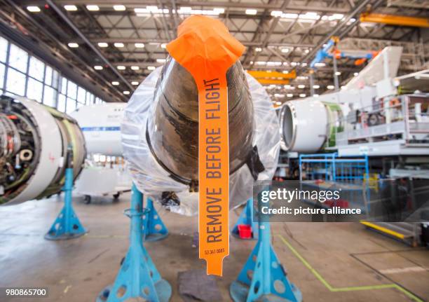 March 2018, Germany, Hamburg: A tag reading 'remove before flight' dangles from a plane for stratospheric research manufactured by Boing in a...