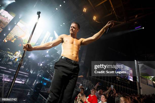 Dan Reynolds of Imagine Dragons performs during their Evolve World Tour 2018 at DTE Energy Music Theater on June 21, 2018 in Clarkston, Michigan.