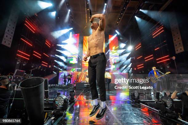 Dan Reynolds of Imagine Dragons performs during their Evolve World Tour 2018 at DTE Energy Music Theater on June 21, 2018 in Clarkston, Michigan.