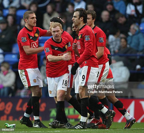 Ryan Giggs of Manchester United celebrates his part in an own-goal scoerd by Jlloyd Samuel of Bolton Wanderers during the FA Barclays Premier League...