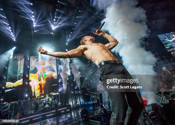Dan Reynolds of Imagine Dragons performs during their Evolve World Tour 2018 at DTE Energy Music Theater on June 21, 2018 in Clarkston, Michigan.