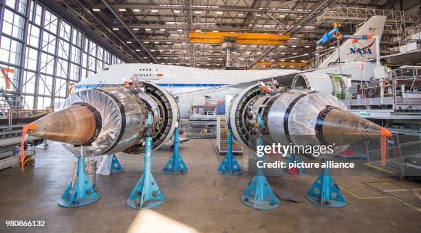 March 2018, Germany, Hamburg: A plane for stratospheric research manufactured by Boing stands in the maintenance hall. Lufthansa Technik's board is...
