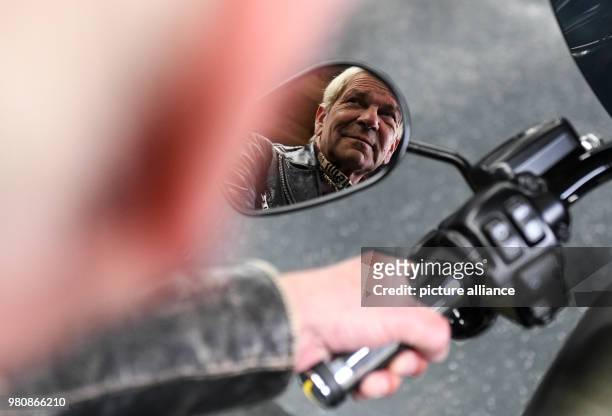 Dpatop - 16 March 2018, Germany, Tuttlingen: Singer Matthias Reim sits on his new Harly Davidson and looks in the rearview mirror. His new album...